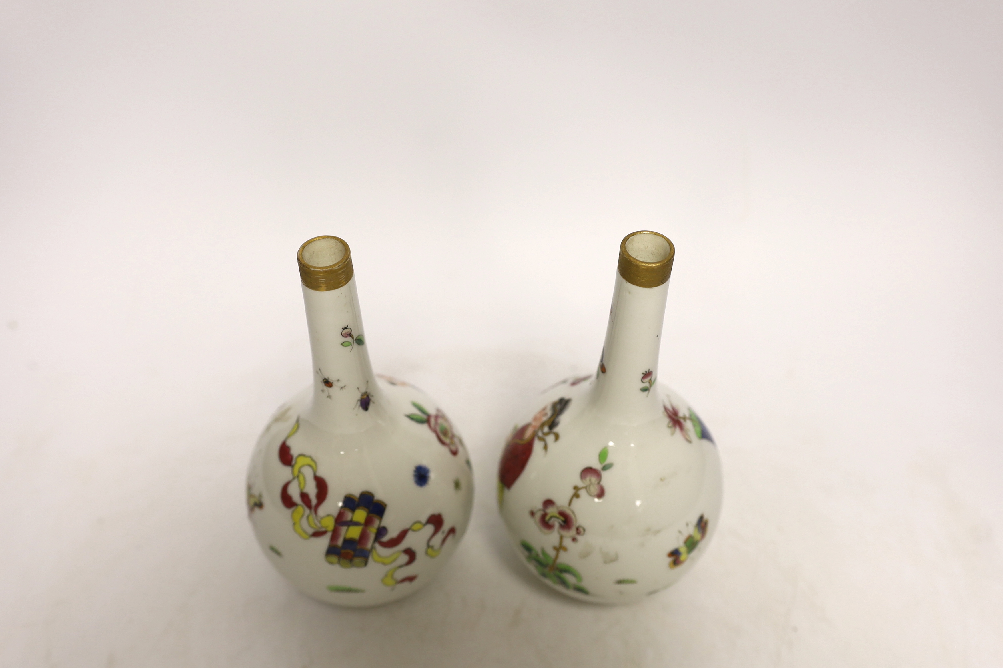 A pair of Continental porcelain bottle neck vases, 17cm high